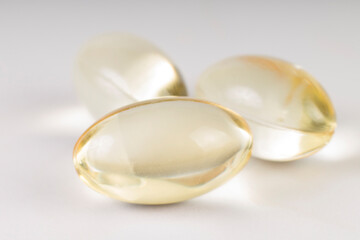 golden pills on white