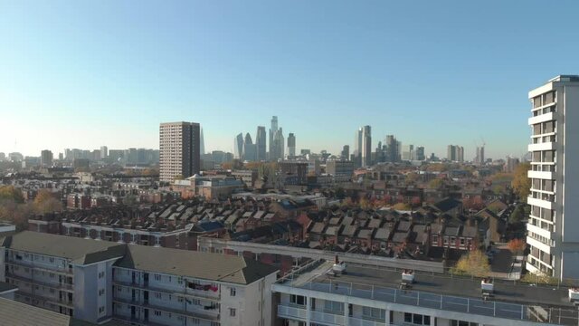 Rising drone shot of residential London looking towards the financial centre