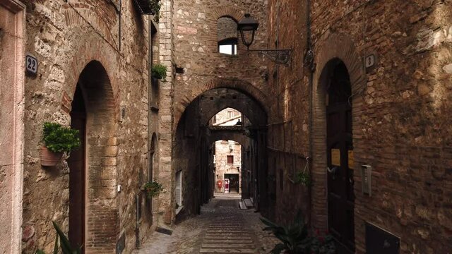 Narrow medieval street in Narni called via del campanile.  Narni is located in Umbria, a central regio of Italy.
