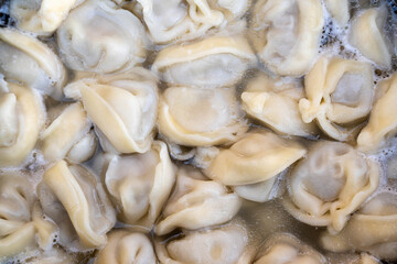 Fresh meat dumplings closeup background.