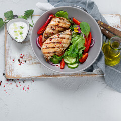Grilled chicken fillet and vegetable salad