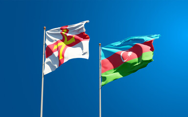 Beautiful national state flags of Guernsey and Azerbaijan together at the sky background. 3D artwork concept.