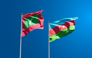 Beautiful national state flags of Maldives and Azerbaijan together at the sky background. 3D artwork concept..