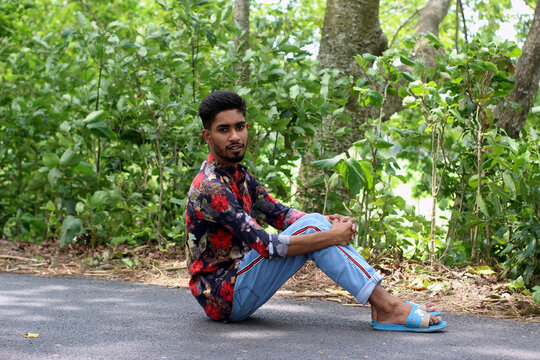 the teenager costs on a footpath in the wood