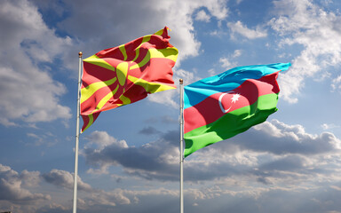 Beautiful national state flags of North Macedonia and Azerbaijan together at the sky background. 3D artwork concept.