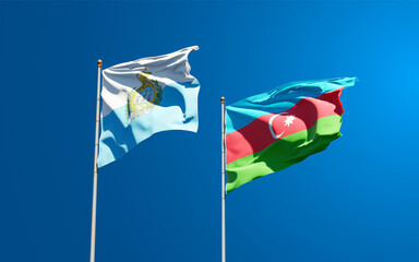 Beautiful national state flags of San Marino and Azerbaijan together at the sky background. 3D artwork concept.