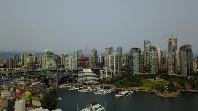 Drone video view from downtown eastside overlooking north Vancouver over the harbour and Lions Gate Bridge.