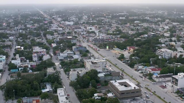 LTR Aerial Pan of Busy Main Street in Tulum Mexico, a Fast Growing Tourist Town in the Yucat&aacute;n Peninsula