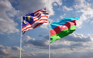 Beautiful national state flags of Malaysia and Azerbaijan together at the sky background. 3D artwork concept.