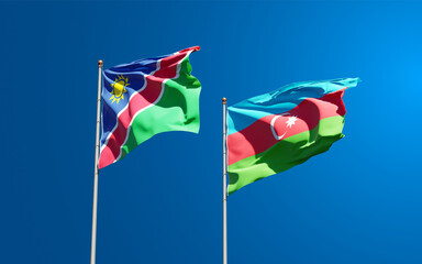 Beautiful national state flags of Namibia and Azerbaijan together at the sky background. 3D artwork concept.