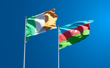 Beautiful national state flags of Ireland and Azerbaijan together at the sky background. 3D artwork concept.