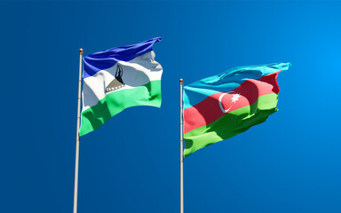 Beautiful national state flags of Lesotho and Azerbaijan together at the sky background. 3D artwork concept.