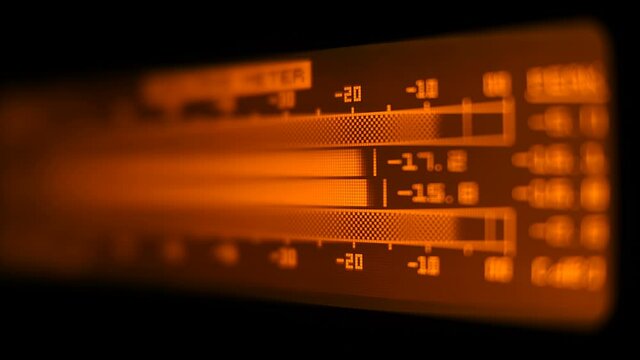 Yellow color volume meter of  stereo sound on professional high quality music recording equipment. Closeup