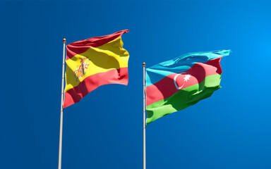 Beautiful national state flags of Spain and Azerbaijan together at the sky background. 3D artwork concept.