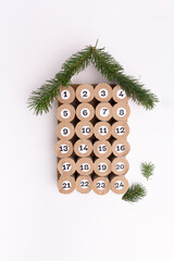simple advent calendar made of empty toilet paper rolls, recycled material craft for kids