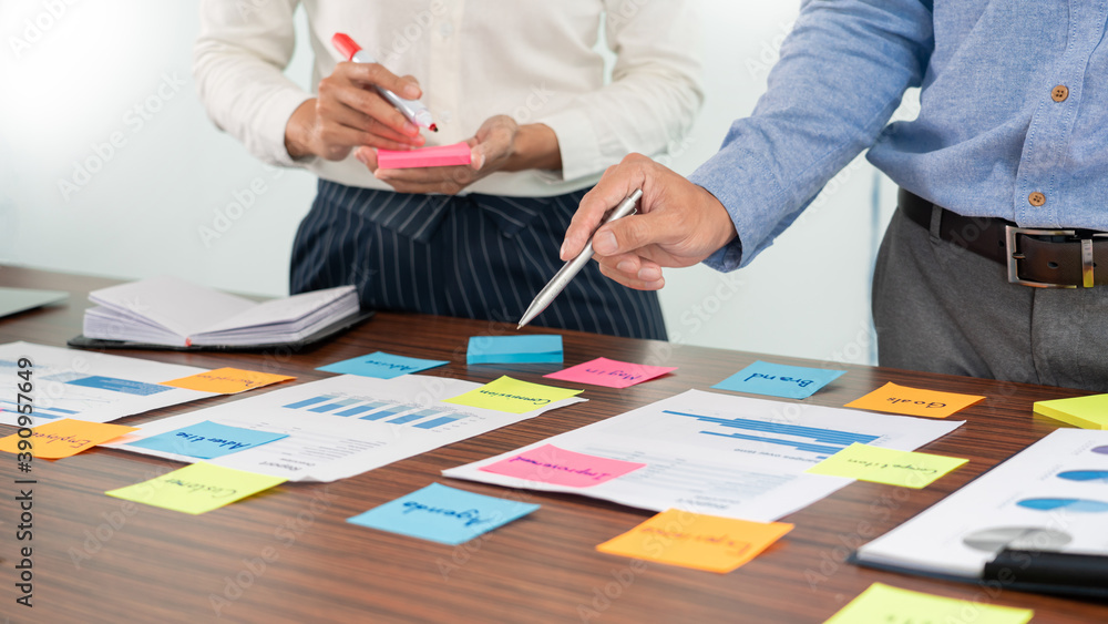 Poster businessman stick colorful notes to brainstorming on the table working on new project to share idea 