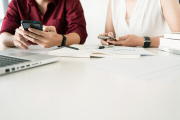 Young woman and man studying for a test or exam Tutor books with friends catching up and learning, education and school concept.