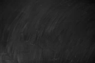 Abstract texture of chalk rubbed out on green blackboard or chalkboard background. School education, dark wall backdrop or learning concept.