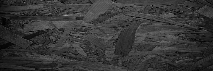 Panorama dark wood scraps patch texture background.Black plywood