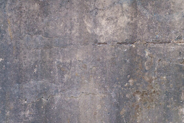 Old textured concrete wall with metal reinforcement. Background