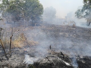 Dirty smoke caused by fire. Soaring in the sky