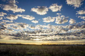 sky with clouds and sun. sunset