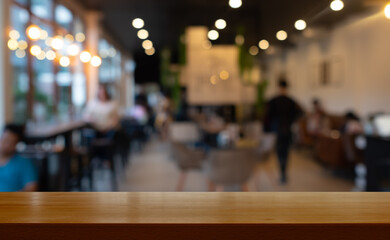 wooden table with  blurred cafe  restaurant