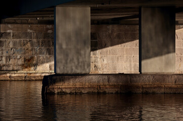 Concrete columns of a bridge over a lake