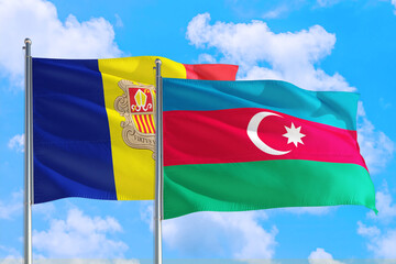 Azerbaijan and Andorra national flag waving in the windy deep blue sky. Diplomacy and international relations concept.