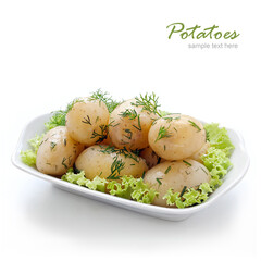 Boiled Potatoes with dill on green salad leaves