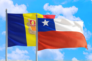 Chile and Andorra national flag waving in the windy deep blue sky. Diplomacy and international relations concept.