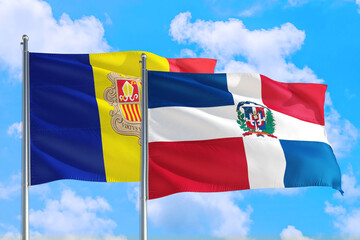 Dominican Republic and Andorra national flag waving in the windy deep blue sky. Diplomacy and international relations concept.