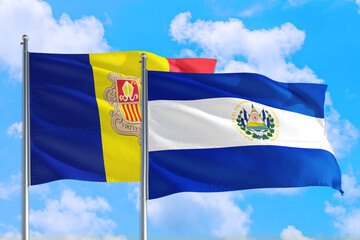 El Salvador and Andorra national flag waving in the windy deep blue sky. Diplomacy and international relations concept.