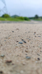 Fototapeta na wymiar selective focus on sand on road