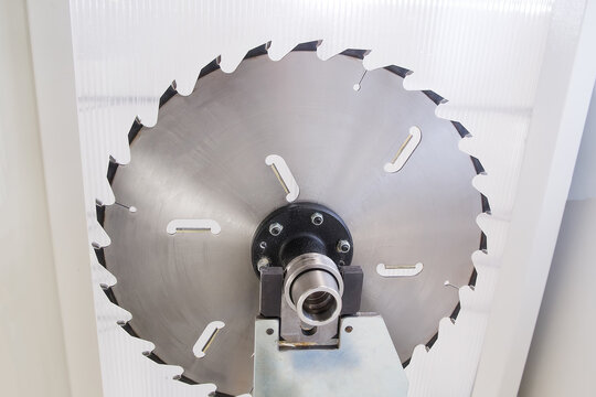 Circular saw machine. Woodworking industry concept. Selective focusing on the saw teeth.