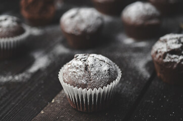 Dark chocolate muffins on the table