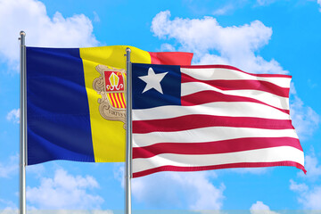 Liberia and Andorra national flag waving in the windy deep blue sky. Diplomacy and international...