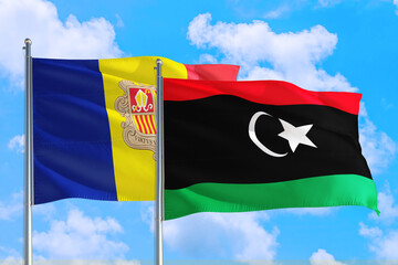 Libya and Andorra national flag waving in the windy deep blue sky. Diplomacy and international...
