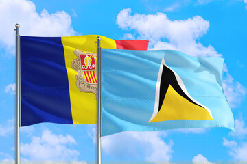 Saint Lucia and Andorra national flag waving in the windy deep blue sky. Diplomacy and international relations concept.