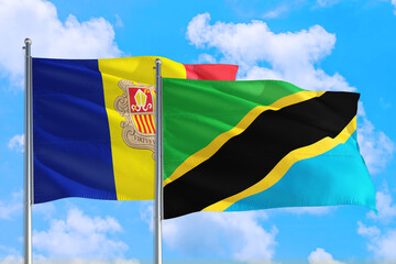 Tanzania and Andorra national flag waving in the windy deep blue sky. Diplomacy and international relations concept.