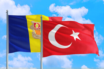 Turkey and Andorra national flag waving in the windy deep blue sky. Diplomacy and international...