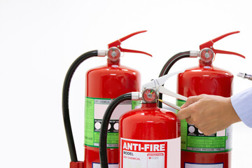 Obraz premium Fire protection engineering checking inspection services the red fire extinguishers tank in the building concepts of prevent emergency and safety rescue and fire training.