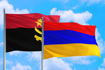Armenia and Angola national flag waving in the windy deep blue sky. Diplomacy and international relations concept.