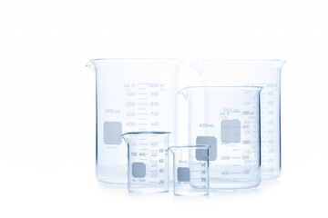 Mix size of measuring beakers for science experiment in laboratory isolated