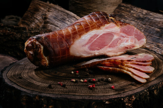 Golden, fresh, appetizing pork ham, pork leg, smoked, grilled, BBQ. Snacks for beer, for gourmets. Natural homemade food.