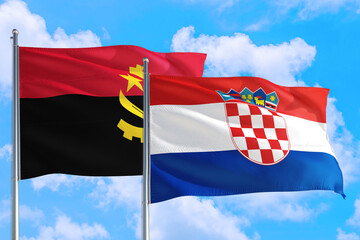 Croatia and Angola national flag waving in the windy deep blue sky. Diplomacy and international relations concept.