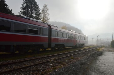 red train and foggy morning