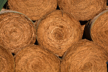 close up of hay bales stacked together 