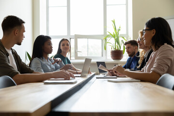 Boardroom conference. Professional corporate workforce diverse business group team sitting at desk...