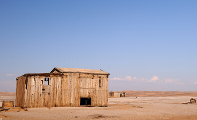 A wooden shack leftover of the diamond mining of yesteryear in the Namib desert